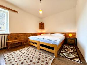 a bedroom with a bed in the corner of a room at Villa ai noci in Carano