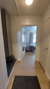 a room with a bedroom with a bed and a door at Modern studio apartment near the harbor and city center in Lappeenranta