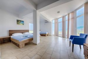 a bedroom with a bed and a desk and a chair at Vila Pepic in Dobra Voda +45 photos