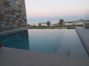 a view of a swimming pool in a house at Thea Syros in Ermoupoli