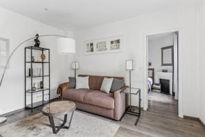 a living room with a couch and a table at Loft Fraternité in Bagnolet