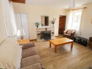 a living room with a couch and a table at Ocean View in Westport