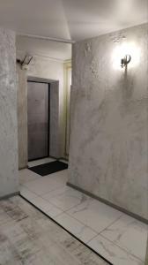 an empty room with a wall and a door at Подобово Центр in Konotop