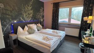 Krevet ili kreveti u jedinici u okviru objekta Hotel De Lange Man