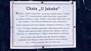 a sign on the side of a building with a menu at U Jakuba - Boba in Prášily