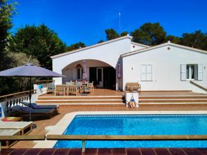 a villa with a swimming pool in front of a house at La FINCAD4 entre plages et Forêt in Son Parc