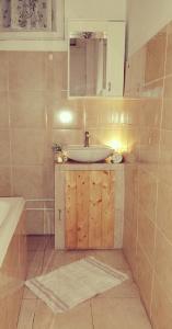 a bathroom with a sink and a mirror at Bistrički mir - Rustic House in Petrovac na Mlavi