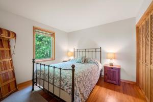 a bedroom with a bed and a window at Shenandoah A-Frame Chalet at Bryce Resort in Basye