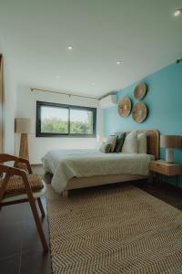 a bedroom with a large bed and a window at Villa Ryx avec piscine in Grimaud +24 photos