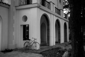 a bike parked in front of a building at Can Passarells in San Vicente de Torelló