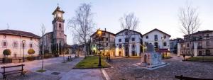 a town square with a church and a clock tower at Mendiko Baserria in Amurrio +30 photos
