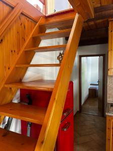a wooden staircase in a tiny house at Bovec Center Stay in Bovec