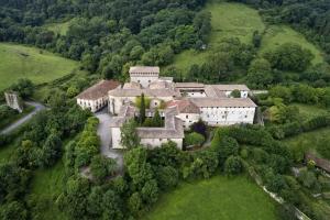 an aerial view of a large house in a field at Mendiko Baserria in Amurrio
