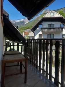 a balcony with a view of a house at Bovec Center Stay in Bovec +46 photos