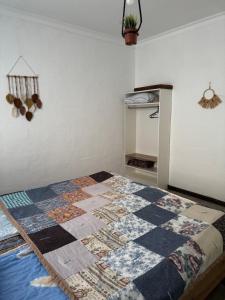 a quilt on a bed in a room at The Bay Area in Cholpon-Ata