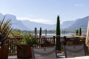 a balcony with a view of a lake and mountains at Gass-Hof in Caldaro