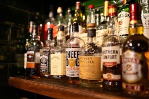 a bunch of bottles of alcohol sitting on a table at The Lugger Inn in Weymouth