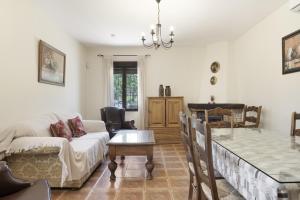 a living room with a couch and a table at La Pedrosa in La Cimada