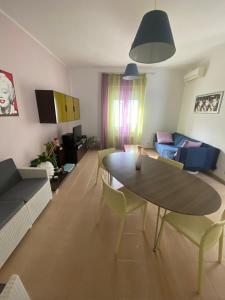 a living room with a table and a couch at La Villetta in Giulianova