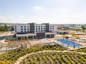 an aerial view of a building with a garden at Parkest Hôtel & Spa in Genas