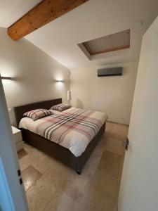 a bedroom with a large bed in a room at Villa Bon Cavai in Mornas +18 photos