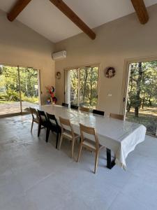 a dining room with a large table and chairs at Villa Bon Cavai in Mornas