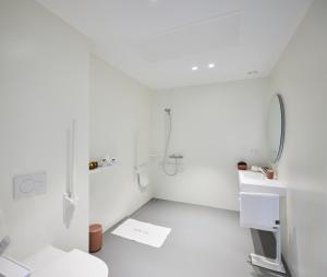 a white bathroom with a shower and a toilet at Vakantiewoning Belle Vue in Hooglede +18 photos
