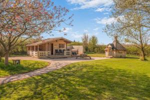 a cabin in the middle of a yard with a picnic table at 6 Bed in Blackburn oc-c38221 in Balderstone