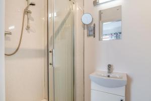a bathroom with a shower and a toilet and a sink at 6 Bed in Blackburn oc-c38221 in Balderstone +26 photos