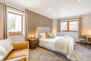 a bedroom with a bed and a couch at 3 Bed in Pitlochry oc-t37864 in Pitlochry