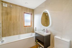 a bathroom with a sink and a tub and a toilet at 3 Bed in Pitlochry oc-t37864 in Pitlochry +21 photos