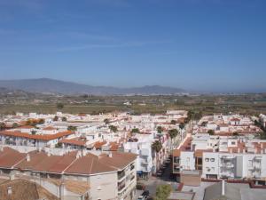 an aerial view of a city with buildings at Pensión Mari Carmen in Salobreña