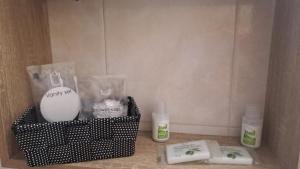 a bathroom with two bottles of lotion and two soap at Trilogy b&b in Celano