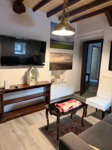 a living room with a couch and a table at Malva in Grado
