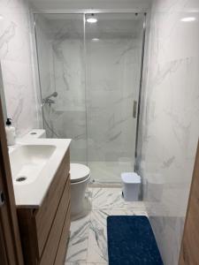 a bathroom with a shower and a toilet and a sink at Malva in Grado +23 photos