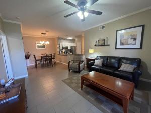 a living room with a couch and a table at 2 Bedroom 2 Bathroom Ground Floor Condo Ahwatukee in Phoenix