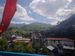 a view of a city with mountains in the background at Yang home stay in Dirang Dzong