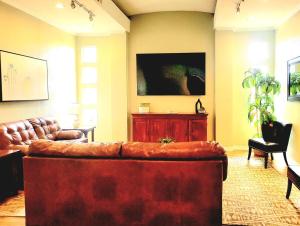 a living room with a large couch in a room at 2 Bedroom 2 Bathroom Ground Floor Condo Ahwatukee in Phoenix