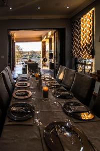 a long table with wine glasses on top of it at LeoLapa in Hectorspruit