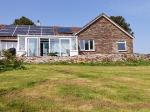 a house with solar panels on the roof at Tregoning in Lostwithiel