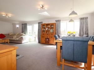 a large living room with a kitchen and a living room at Tregoning in Lostwithiel