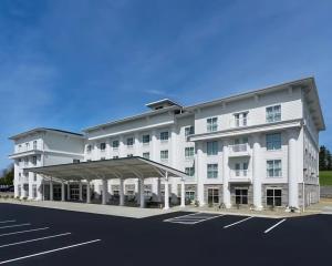 a rendering of a white building with a parking lot at Tannery Suites in DuBois