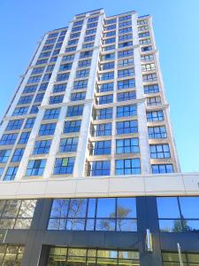 a tall building with a lot of windows at Apartment in Chantrer Residence with garage in Burgas