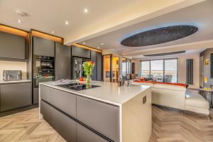 a kitchen with a white island in a room at 3 Bed in Amble oc-h36627 in Amble
