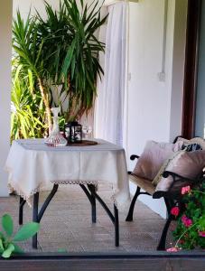 a table with a vase on it in a living room at Bistrički mir - Imanje in Bistrica