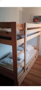 a couple of bunk beds in a room at Studio les pieds dans l eau in Sarzeau