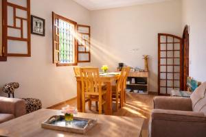 a living room with a table and chairs at Villa Dar Nata in Tougouana