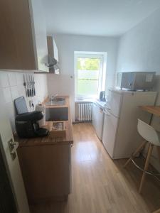 a kitchen with a sink and a counter top at BR Apartment in Kiel