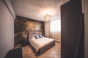 a bedroom with a bed and a wall mural at Villa Maggie on Lake Como in Malgrate +60 photos