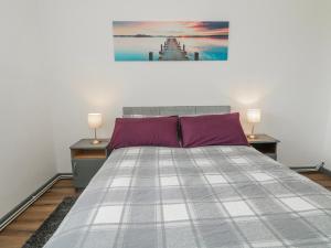 a bedroom with a large bed with two night stands at The Island's View in Letterkenny